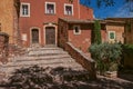 View of traditional colorful house in ocher and staircase, in Roussillon.