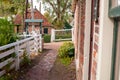 View on traditional Dutch houses and streets in a recreated heritage museum with beautiful historic vintage scenes from Holland.