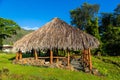 View of a traditional Hawaiian house standing in the park near Honolulu on a blue sky background