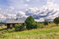 View of the traditional log house with a rickety wooden fence. Village of Visim, Sverdlovsk region, Russia Royalty Free Stock Photo