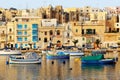 The view on traditional Maltese boats in sunset