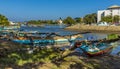 A view of traditional outrigger canoes moored on the banks of a tributary to the lagoon in Negombo, Sri Lanka Royalty Free Stock Photo