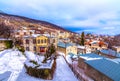 View of traditional stone buildings and streets with snow at the famous village of Nymfaio near Florina, Greece Royalty Free Stock Photo