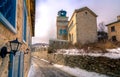 View of traditional stone buildings and streets with snow at the famous village of Nymfaio near Florina, Greece Royalty Free Stock Photo