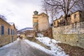 View of traditional stone buildings and streets with snow at the famous village of Nymfaio near Florina. Royalty Free Stock Photo
