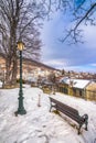 View of traditional stone buildings and streets with snow at the famous village of Nymfaio near Florina. Royalty Free Stock Photo