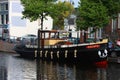Traditional style old boat on waterway in Leiden