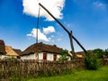 View on a traditional well and hungarian pise houses in Szentendre