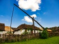 View on a traditional well and hungarian pise houses in Szentendre