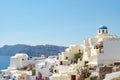 View with traditional white buildings over the village of Oia
