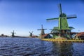 View of Traditional Wooden Dutch Windmills at the Zaan River Royalty Free Stock Photo