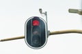 View of a traffic light and a traffic camera that captures the passage of a red traffic light. Royalty Free Stock Photo