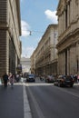 View with traffic and people walking on Via del Corso, Rome, Italy