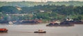 View of traffic of tugboats pulling barge of coal at Mahakam River, Samarinda, Indonesia.