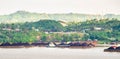 View of traffic of tugboats pulling barge of coal at Mahakam River, Samarinda, Indonesia.