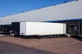 View of trailers in front of loading doors at a warehouse