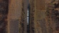 Locomotive pulls railway freight train with wagons filled coal Top View of train Royalty Free Stock Photo