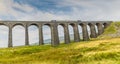 A view of a train crossing the Ribblehead Viaduct, Yorkshire, UK