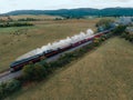 View of a train engine moving through a rural landscape Royalty Free Stock Photo