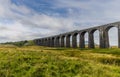 A view of a train on the middle of the Ribblehead Viaduct, Yorkshire, UK