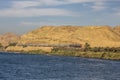 View of the train running along the side of the Nile River Royalty Free Stock Photo