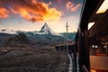 View from train with sunrise over Matterhorn mountain during ride up to Gornergrat station in Zermatt, Switzerland Royalty Free Stock Photo