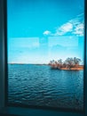 View from the window of the house on the lake and the sky with clouds Royalty Free Stock Photo