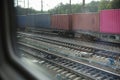 view from the train window to the railway station, freight train and railway Royalty Free Stock Photo