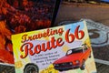 View on travel guide books on wood table for preparation of Route 66 trip