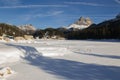 View of The Tre Cime di Lavaredo mountains 3003 m and Lago di Misurina lake with snow in december. Dolomites, South Tyrol Royalty Free Stock Photo