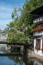 trees in border the Il river at the little france quarter and medieval house in Strasbourg Royalty Free Stock Photo