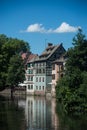 trees in border the Il river at the little france quarter and medieval house in Strasbourg Royalty Free Stock Photo