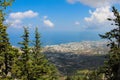 View between the trees from the castle of Saint Hilarion on the city of Kyrenia and the Mediterranean sea. Cyprus Royalty Free Stock Photo