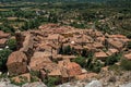 View of trees, house roofs and belfry in Moustiers-Sainte-Marie Royalty Free Stock Photo