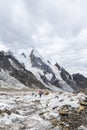 Trekkers on Gondogoro glacier with Laila peak, Gondogoro La trek in Pakistan Royalty Free Stock Photo