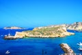 View from Tremiti Islands at rocky spurs, Adriatic Sea, motorboats, gradient sky Royalty Free Stock Photo