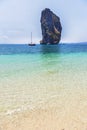 View of tropical beach and clear water and blue sky with limestone rock background at po da island , krabi Thailand Royalty Free Stock Photo