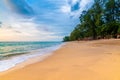 View of tropical beach at Koh Lanta island, Thailand. Bar on the beach are prepared for tourist during beautiful sunset. Soft Royalty Free Stock Photo