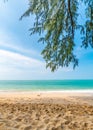 View from tropical beach at Koh Lanta island, Thailand. View to pure sea with boats and yacht on water. Look from shadow of tree