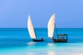 View of tropical sandy Nungwi beach and traditional wooden dhow boats in the Indian ocean on Zanzibar, Tanzania Royalty Free Stock Photo