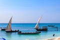 View of tropical sandy Nungwi beach and traditional wooden dhow boats in the Indian ocean on Zanzibar, Tanzania Royalty Free Stock Photo