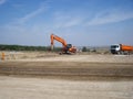 Excavator and truck