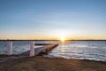 View of Tuggerah Lake in Toukley, Central Coast, NSW, Australia at sunset, with a jetty jutting out Royalty Free Stock Photo