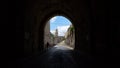 View of a tunnel in the Armenian Patriarchate Street with the Abbey of the Dormition in the background