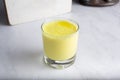 glass of turmeric lassi Indian drink