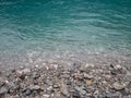 View of turquoise blue creek and foggy mountains Royalty Free Stock Photo