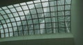 View of Twin Petronas Towers through transparent glass roof. Unusual view of famous buildings