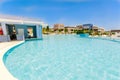 View of two level swimming pool and grounds at Grand Aston hotel, resort on sunny gorgeous summer day Royalty Free Stock Photo