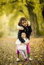 Two little girls at autumn park Royalty Free Stock Photo