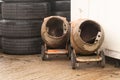 View of two messy cement mixers at construction site